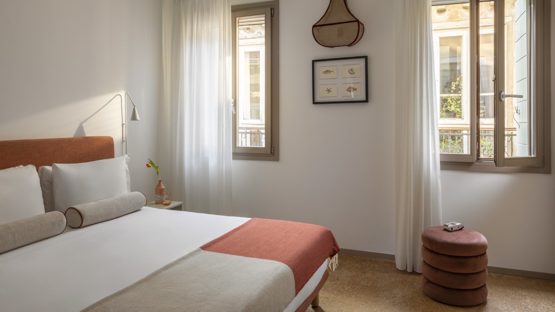 Bright Superior room in Venice with double bed, orange headboard, design ottoman, and city view - Ca' La Stampa, BZAR hotels in Venice