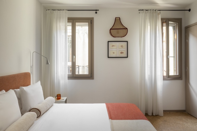 Superior room interior featuring elegant furnishings, marine-themed artwork, and large windows - Ca' La Stampa, BZAR hotels in Venice